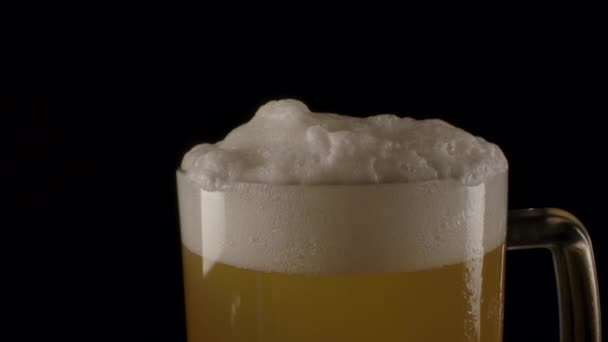 Chilled beer with white foam. - Footage, Video