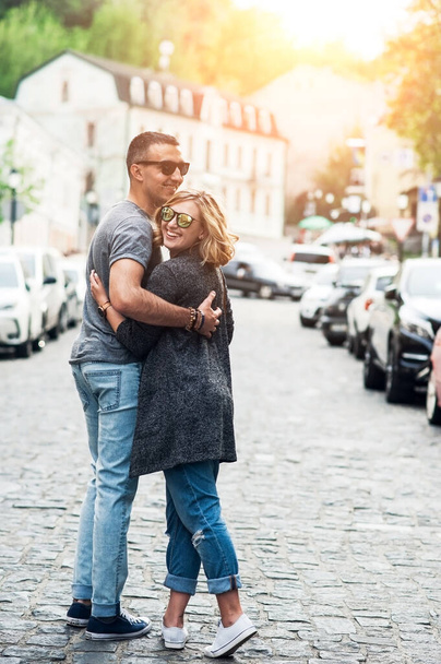 Loving young couple are walking around the city - 写真・画像