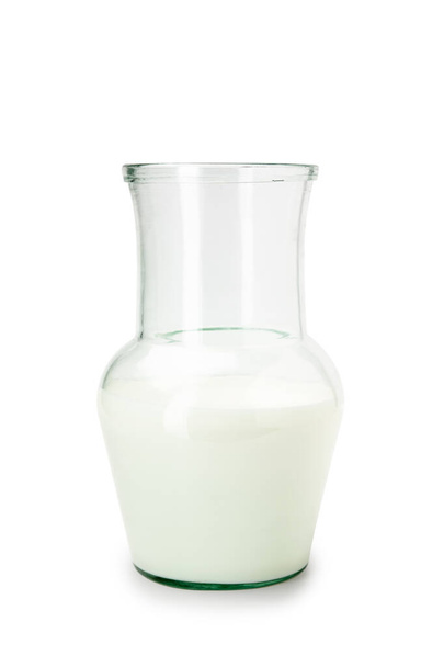 Milk in a glass lid on a white background - Photo, image