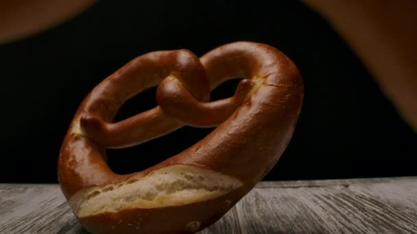 Yummy pretzels arranged on timber table. - Footage, Video