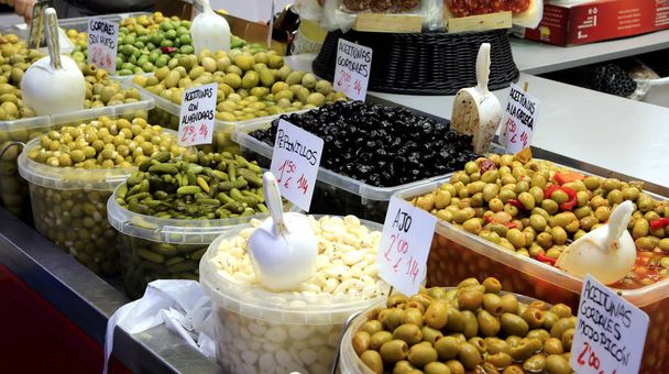A market stall in Malaga, Spain, selling local fresh traditional foods used in tapas - 写真・画像