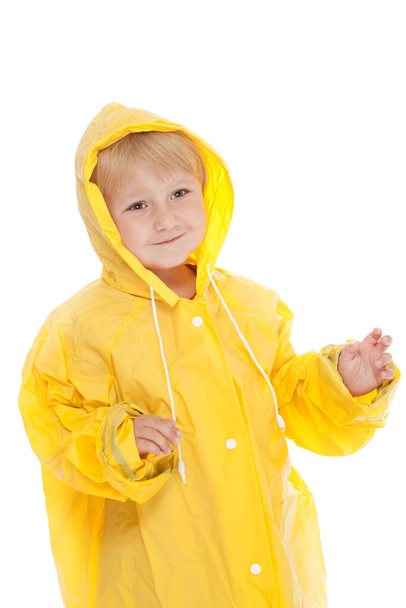 child with yellow raincoat - Фото, зображення