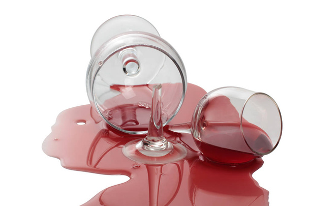 Broken glass with red wine. Isolated object on a white background - Photo, image