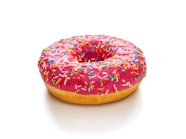Donut with pink icing on a white background - Photo, Image