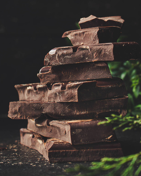 chocolate (delicious cocoa dessert, pieces ofbackground. top view. copy space sweets) menu concept. food  - Фото, изображение