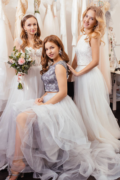good-looking three women together in wedding dresses - Fotoğraf, Görsel