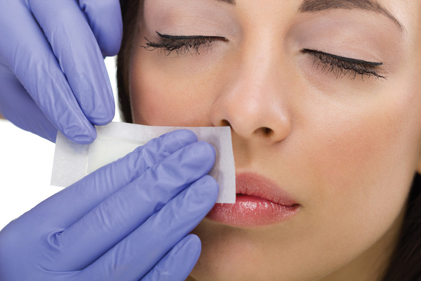 woman reciving facial epilation - Foto, immagini