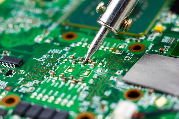 soldering iron for repairing electronic of the computer circuit  - Φωτογραφία, εικόνα