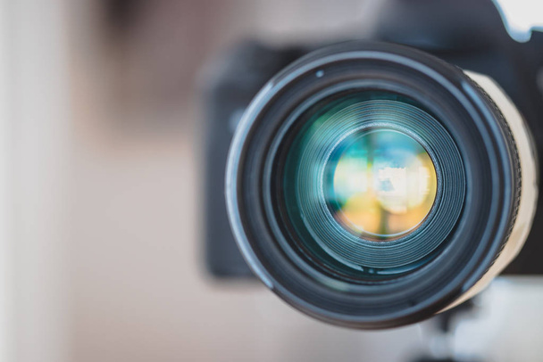 Close up of professional photo camera on a tripod, lens - Foto, imagen