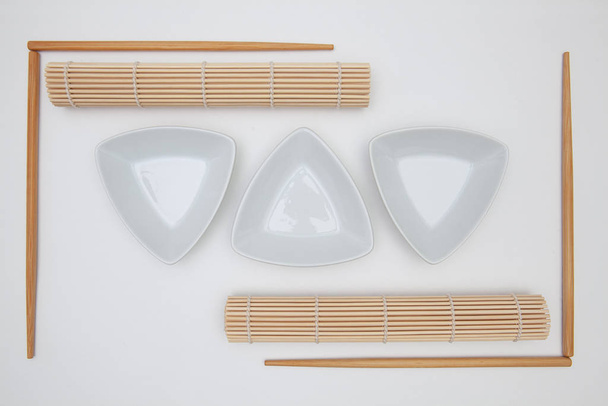 Top View Of White Empty Sushi Plates With Bamboo Chopsticks and  - Valokuva, kuva
