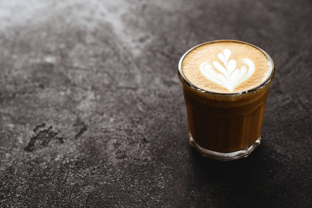 Cup of coffee on black stone background - Zdjęcie, obraz