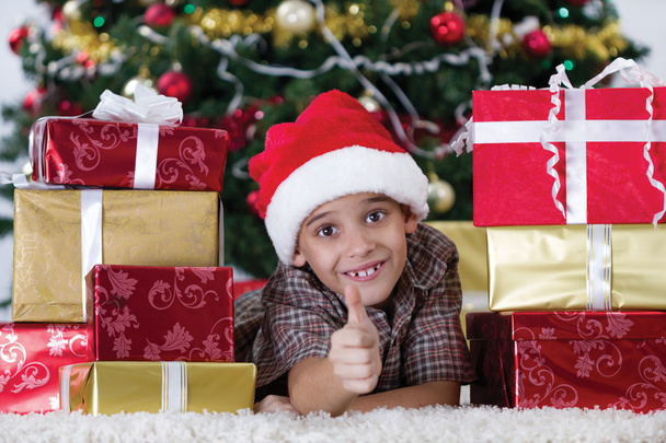 happy little boy near a Christmas tree - Fotó, kép