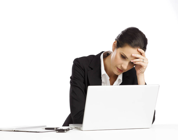 Young Businesswoman depressed looking at laptop - Fotó, kép