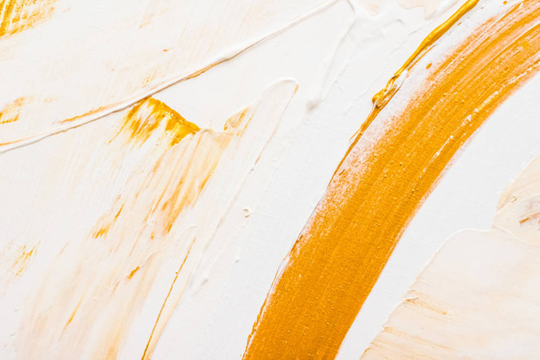 Artistic abstract texture background, golden acrylic paint brush - Foto, Imagen