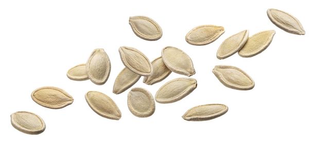 Падіння насіння гарбуза ізольовано на білому тлі
 - Фото, зображення