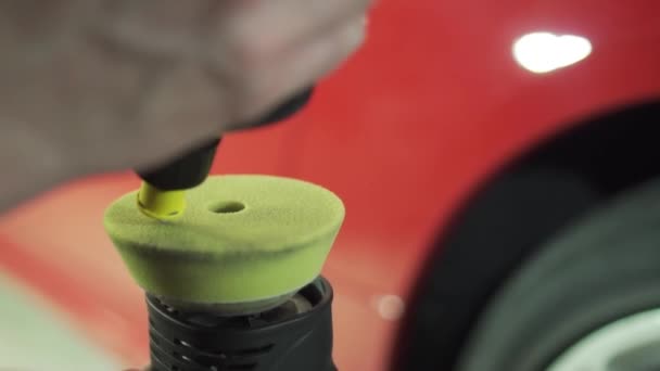 Pouring the paste onto the sponge of the car polisher - Filmmaterial, Video
