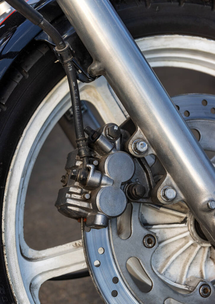 Heavy motorcycle wheel with disc brakes closeup - Foto, Imagen