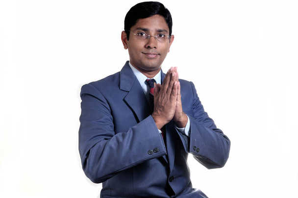 young asian businessman in suit and tie standing against white background - Φωτογραφία, εικόνα