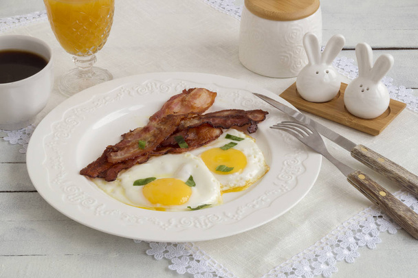 fried eggs with bacon. Sunny side up egg - Photo, Image