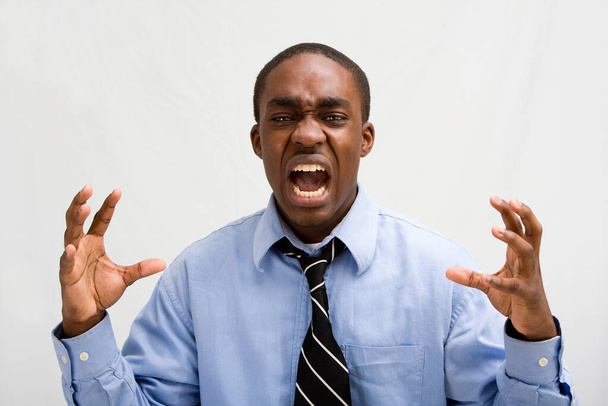 portrait of a young african man in shirt and tie showing ok sign - Foto, Imagem