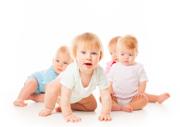Group of funny babies sitting on white background, isolated - Photo, Image