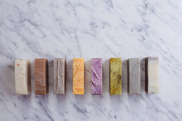 Different handmade soap bars, flat lay, top view. Eco soap and cosmetics. Natural healthy product. - Foto, afbeelding