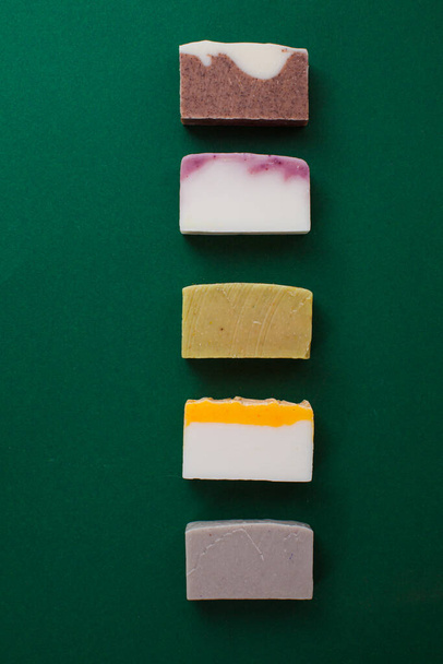 Different handmade soap bars, flat lay, top view. Eco soap and cosmetics. Natural healthy product. - Foto, Imagem