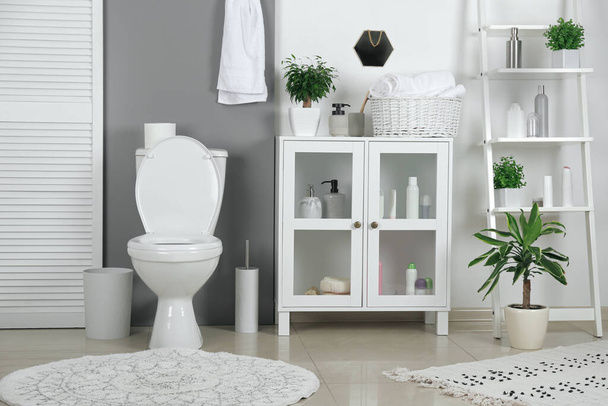 Stylish toilet bowl in modern bathroom interior - Фото, зображення