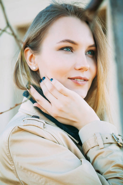 Sensual blue-eyed girl playfully posing on blur background - Fotoğraf, Görsel