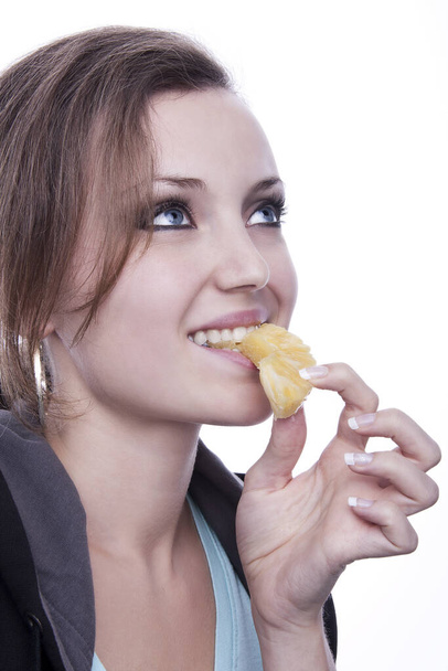 young woman eating a sandwich - Фото, изображение