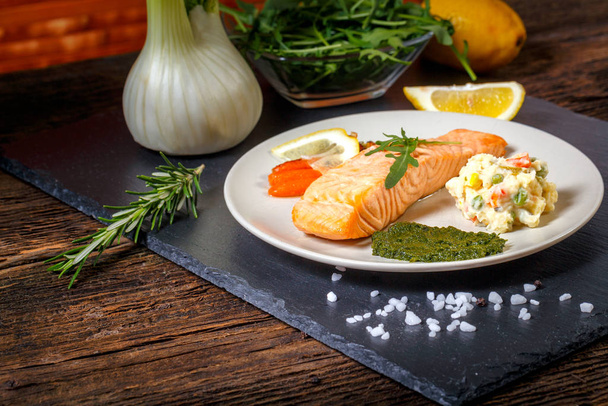 grilled Salmon with lemon, herbs and pesto - Фото, изображение