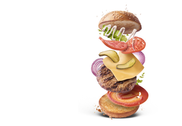Delicious burger with flying ingredients isolate - Photo, Image