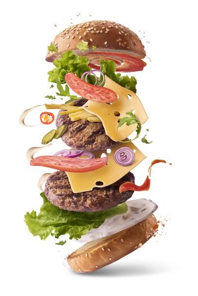 Deliciosa hamburguesa con ingredientes voladores
  - Foto, Imagen
