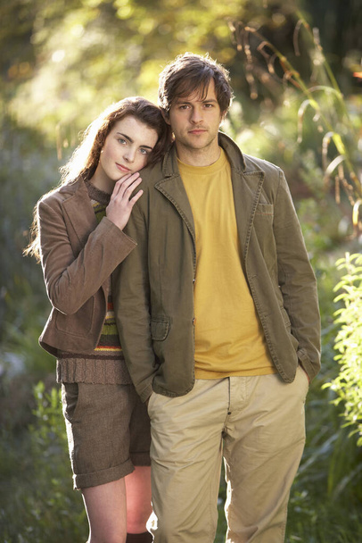 Portrait Of Romantic Young Couple In Autumn Landscape - Photo, image