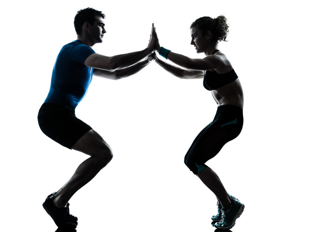 man woman exercising squats workout fitness - Фото, изображение