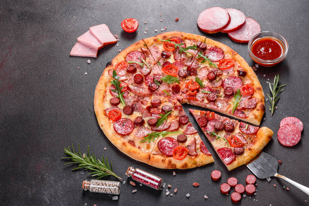Pepperoni Pizza with Mozzarella cheese, salami and ham - Photo, Image