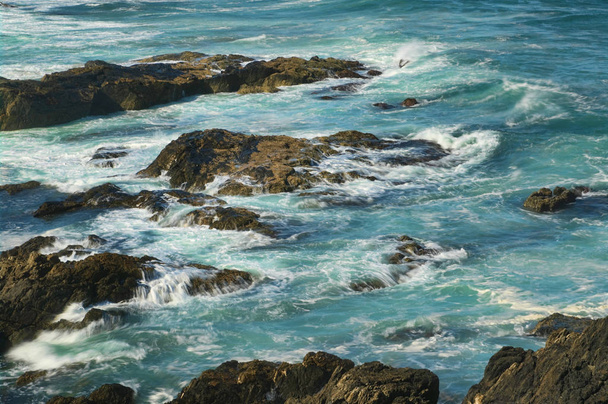 great image of strong waves splashing into the rocks - Fotografie, Obrázek