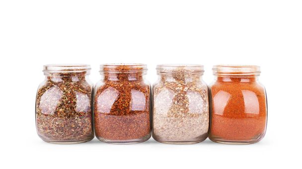 jar of spices in glass jar on white background - Zdjęcie, obraz