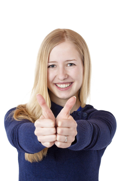 young pretty blond woman showing thumbs up laughing. isolated on white background. - Foto, afbeelding