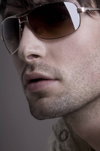 close-up of a handsome man in sunglasses - Fotoğraf, Görsel