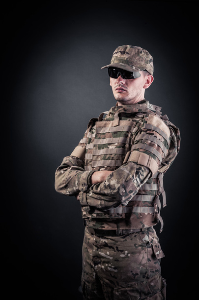 Military man on a black background - Zdjęcie, obraz