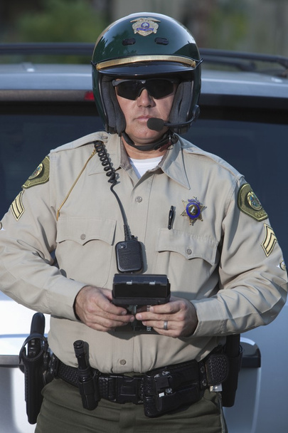 Patrol officer standing near the car - Φωτογραφία, εικόνα