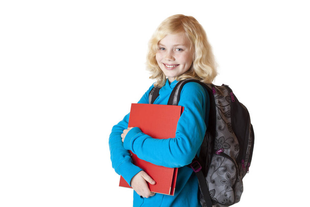 portrait of a pretty blond schoolgirl with schoolbag and backpack.isolated on white background. - Fotografie, Obrázek