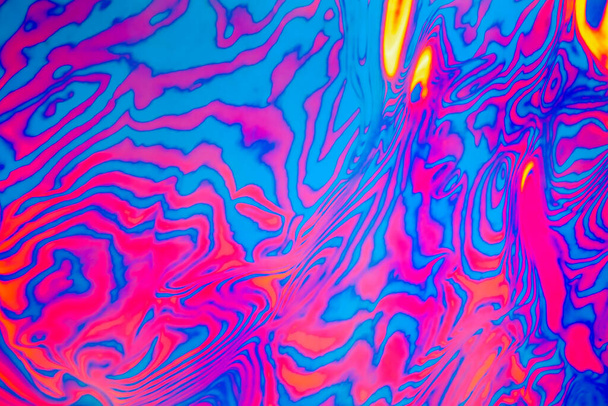 ネオンカラーのサイケデリック蛍光縞ゼブラテクスチャの背景 - 写真・画像