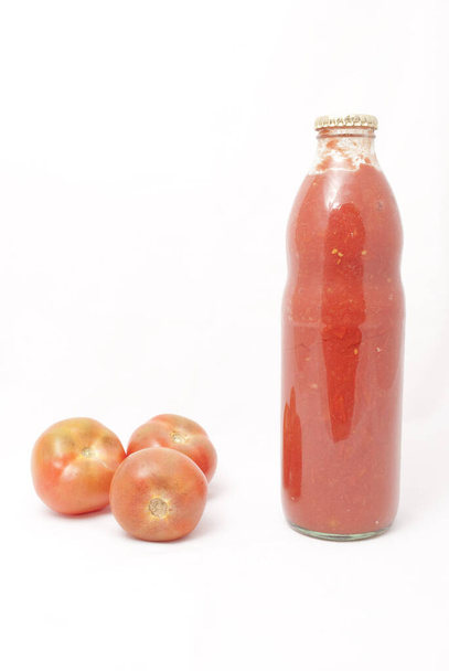 bottle of tomato sauce and fresh tomatoes - Photo, image