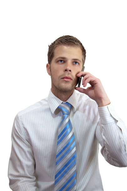 Young businessman holding a mobile phone - Photo, image