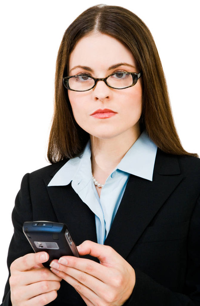 Young businesswoman text messaging on a mobile phone isolated over white - Valokuva, kuva