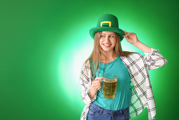Young woman with beer on color background. St. Patrick's Day celebration - Foto, immagini