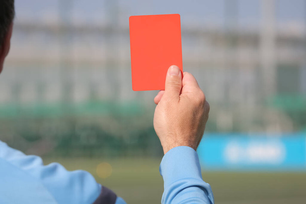 Football referee shows a red card. Disqualification. - Photo, Image