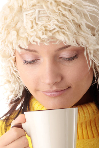 Teen winter girl with cup of hot drink (tea,coffee or milk) - Photo, image